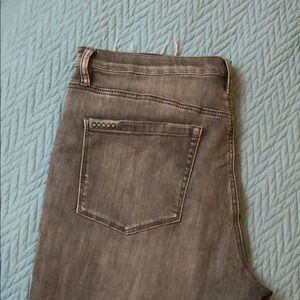 gray distressed jeans with rips